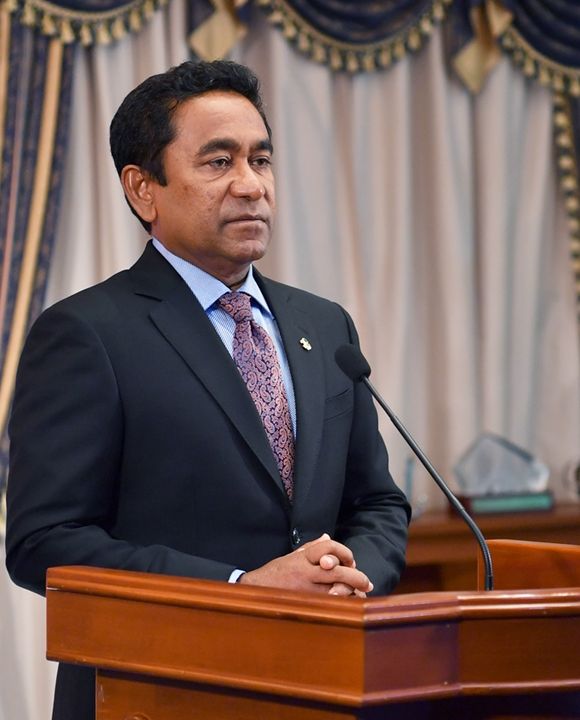 Portrait at the lectern.